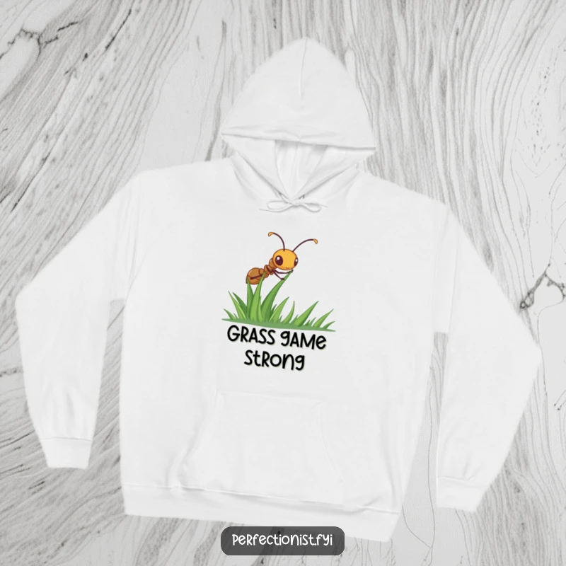 Funny ant hoodie with a diligent ant meticulously straightening a blade of grass, offering cozy comfort with a focus on detail.
