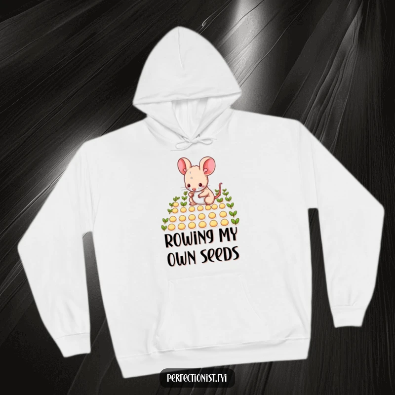 Funny mouse character meticulously arranging tiny seeds in neat rows on a hoodie, perfect for cozy, humorous, and tidy individuals as a funny gift.